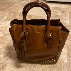 Coach saddle brown bag with tassel